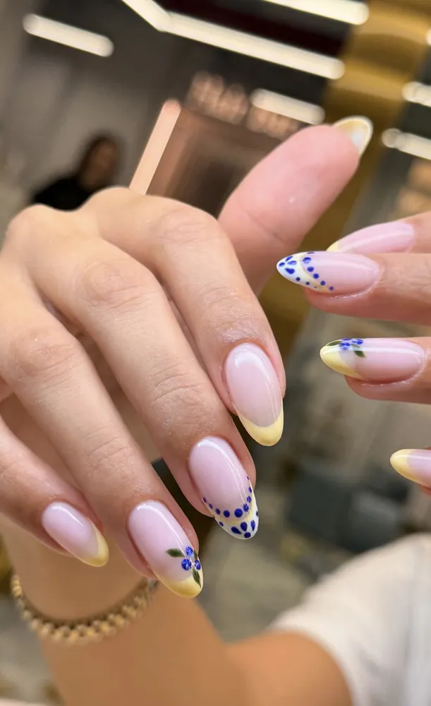 Dalmatian dot nail art on nude almond nails — FILTER Ladies Salon Abu Dhabi