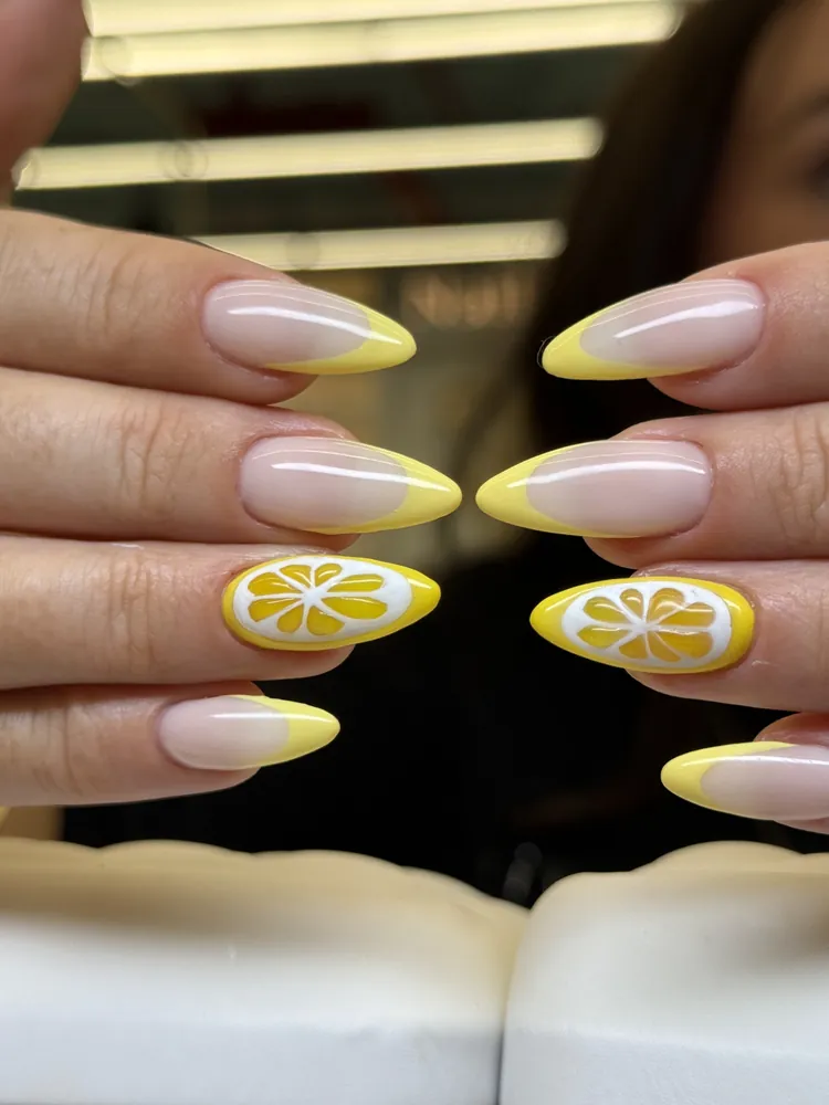 Lemon-slice nail art on French tips — FILTER Ladies Salon Abu Dhabi