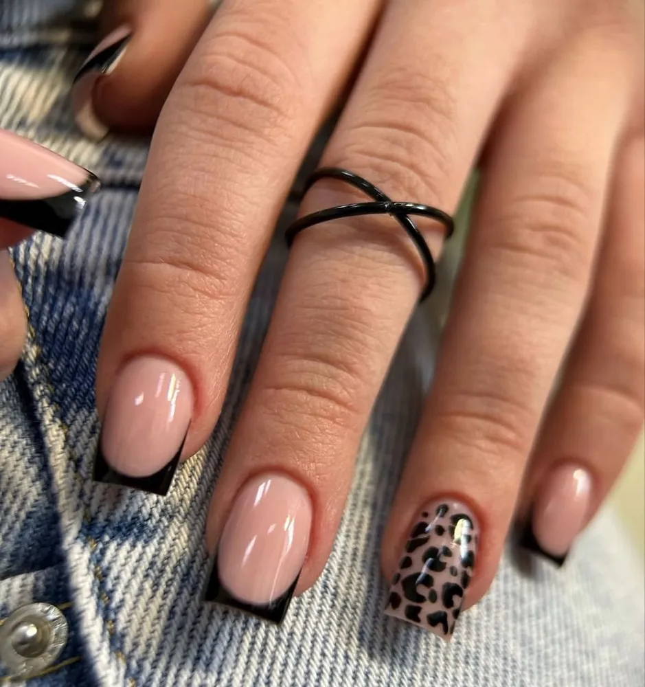 Black tips with leopard accent nail — FILTER Ladies Salon Abu Dhabi