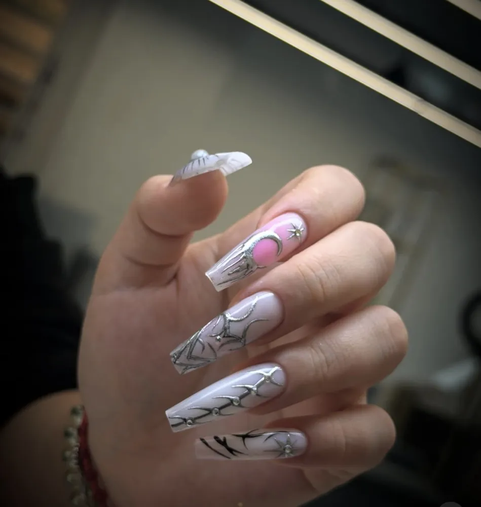 White nails with black line art — FILTER Ladies Salon Abu Dhabi